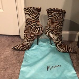 Marciano tan and black zebra print booties.